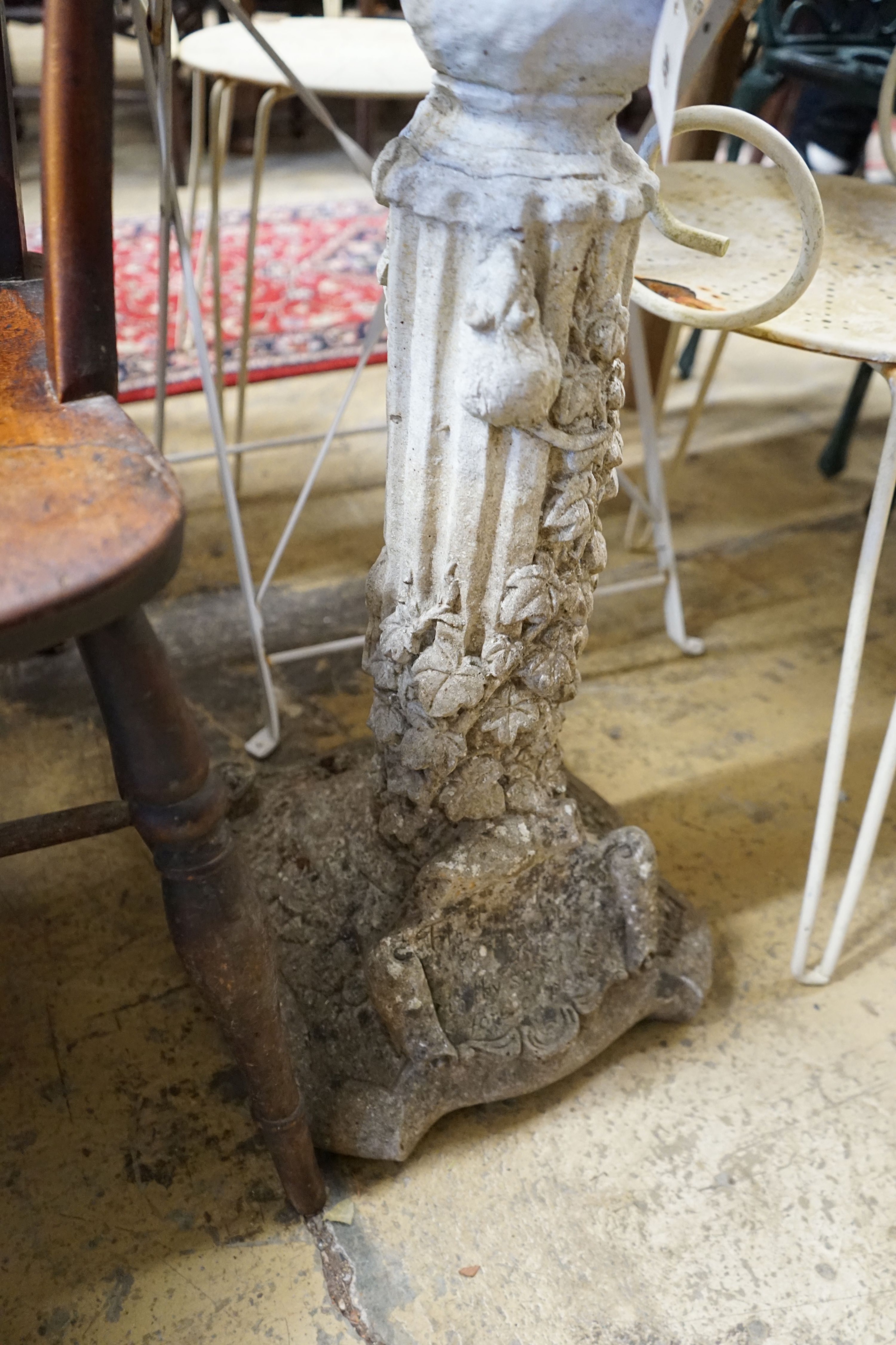 A reconstituted stone garden bird bath, width 32cm, height 81cm
